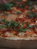 A close-up of a freshly baked pizza topped with vibrant ingredients.