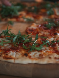 A close-up of a freshly baked pizza topped with vibrant ingredients.