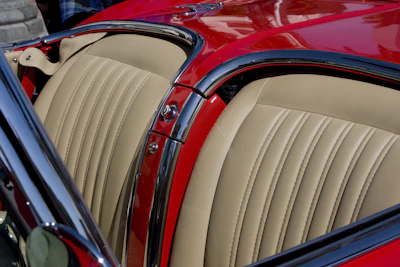 Close-up of a flawlessly restored leather interior with deep conditioning shine.