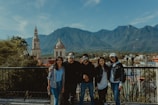 A group of travelers enjoying a scenic mountain view.