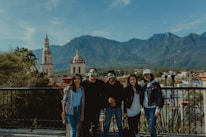A group of happy travelers enjoying a scenic view.