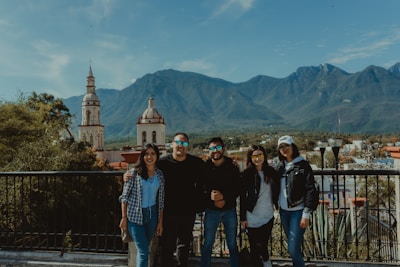 A group of travelers enjoying a scenic mountain view.