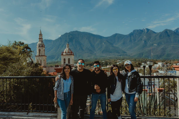 A smiling family enjoying a scenic mountain view during a guided tour.