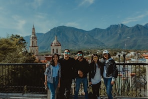 A group of travelers enjoying a scenic mountain view.