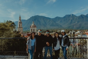 A group of travelers enjoying a scenic mountain view.