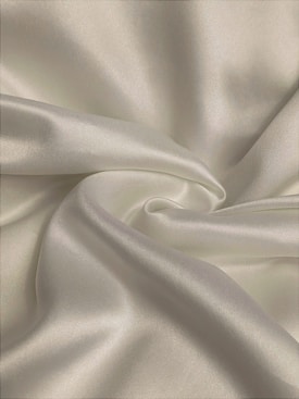 white textile in close up photography