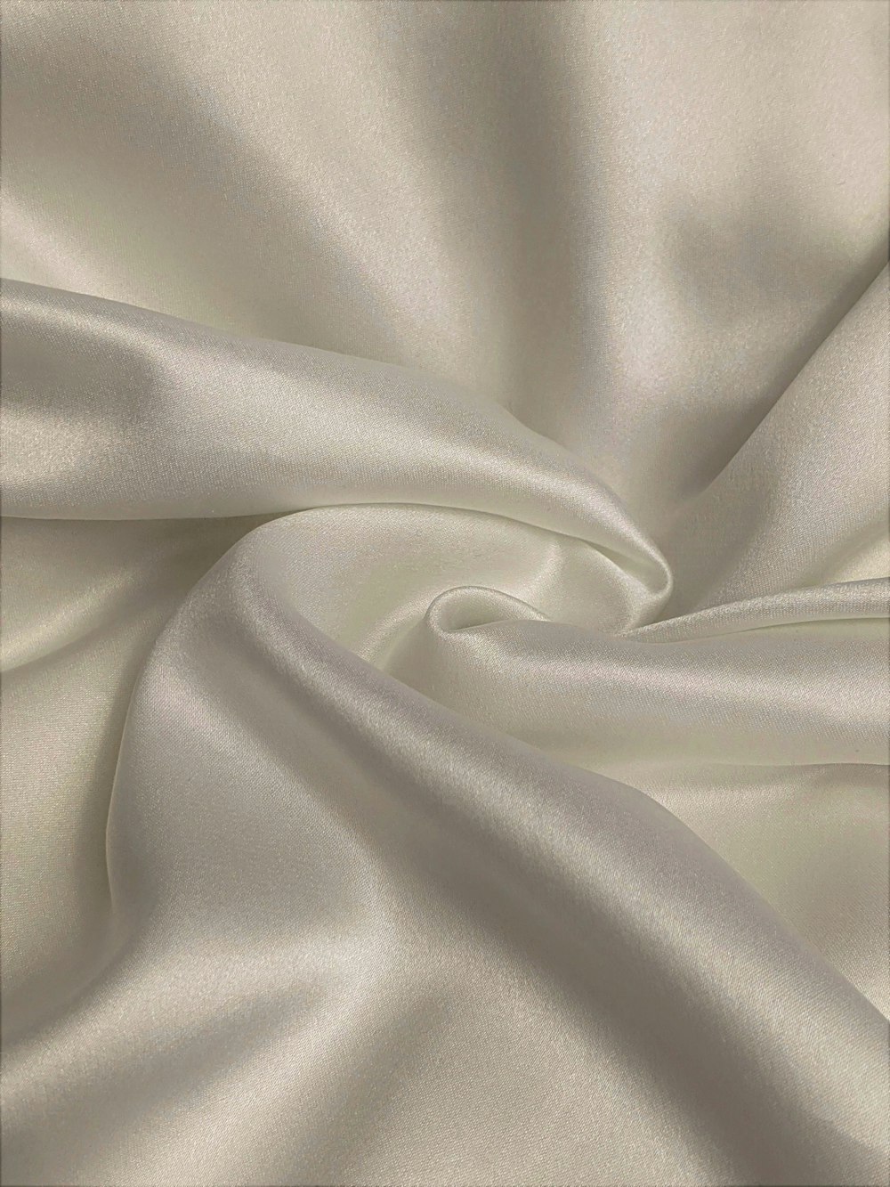 white textile in close up photography