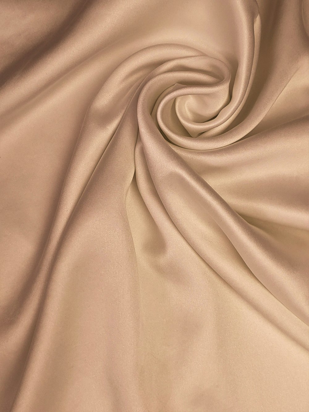 brown textile on white textile