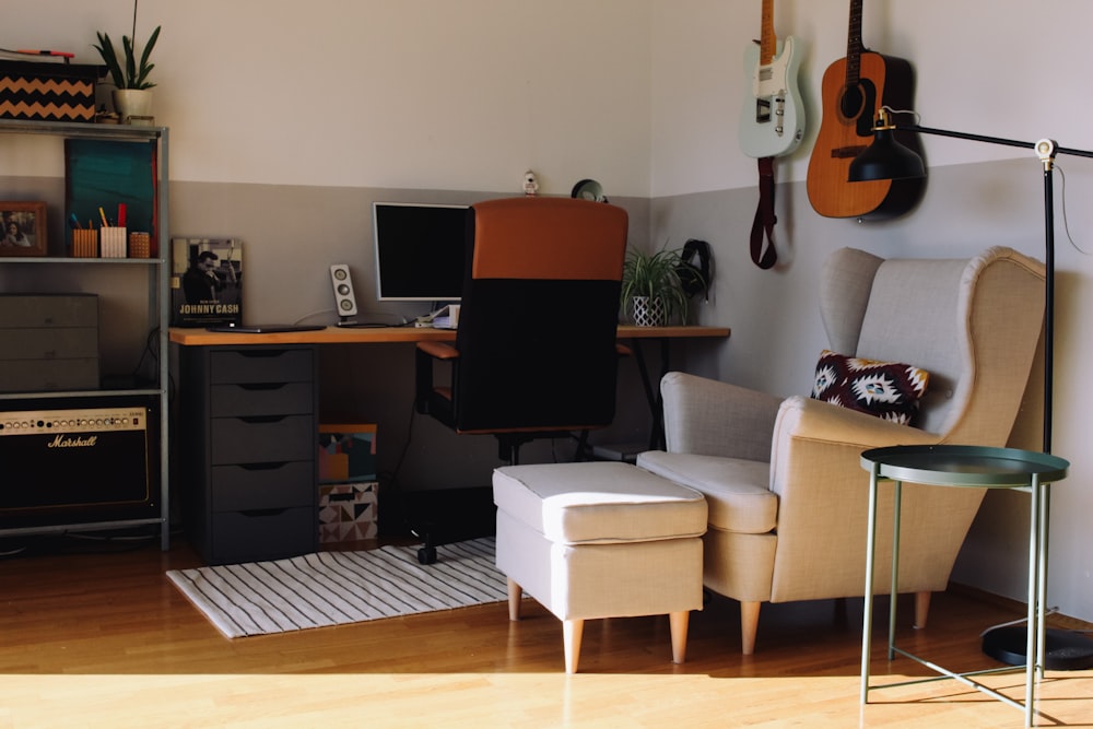 black flat screen computer monitor on brown wooden desk