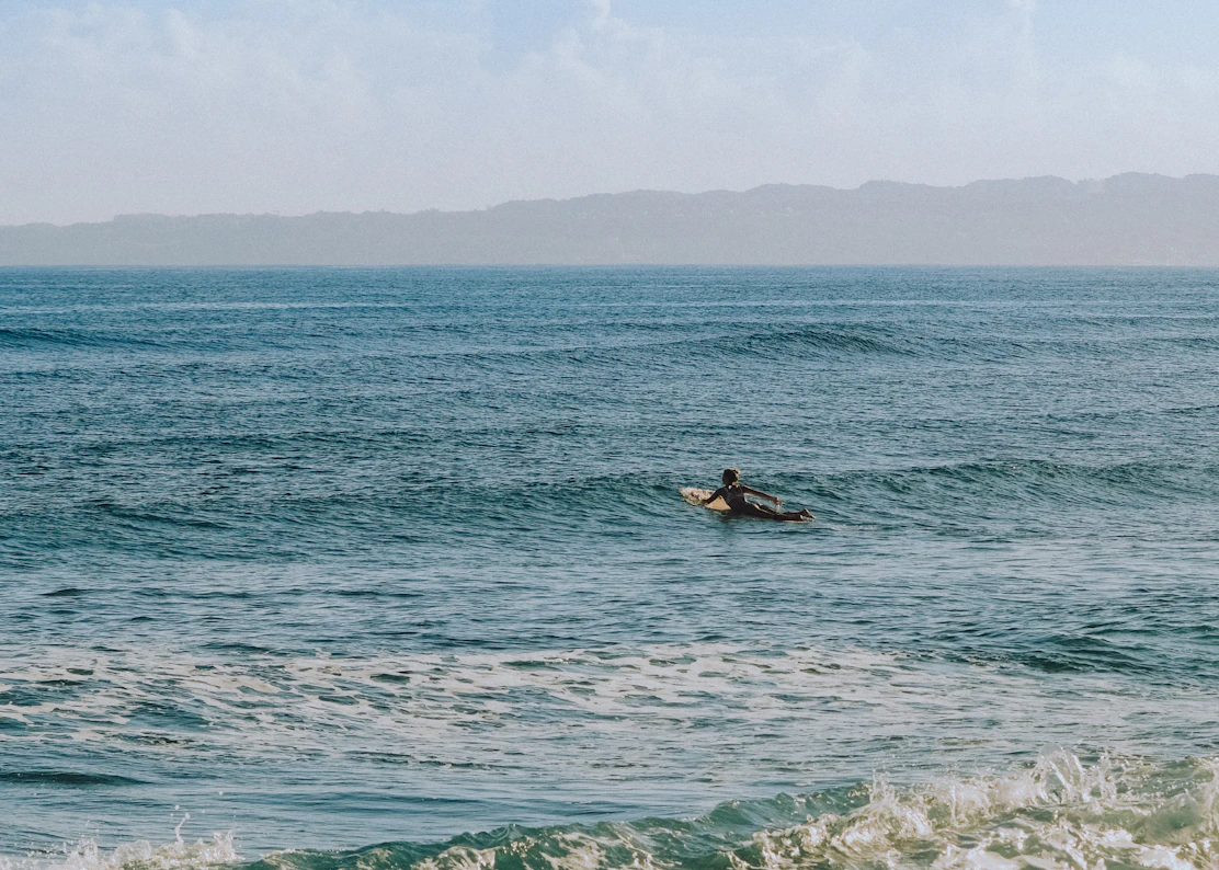 Surfer catching a wave