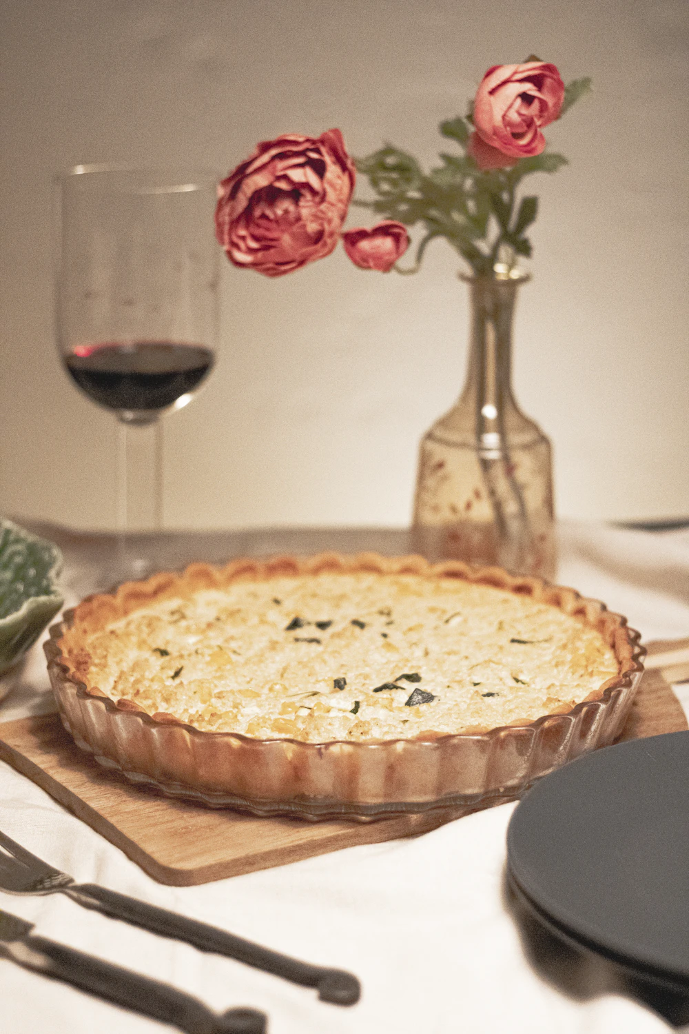 Golden savory tart on a wooden table