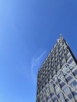 Modern building framework under clear blue sky.