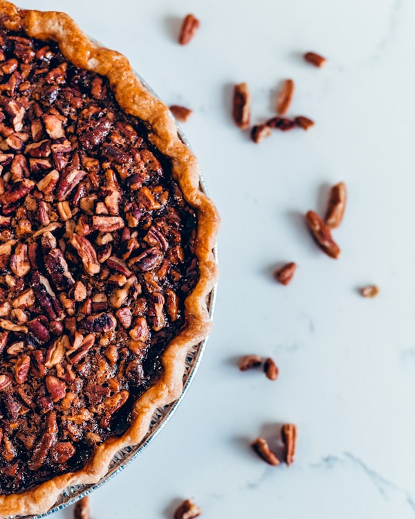 Brown pie on white ceramic plate