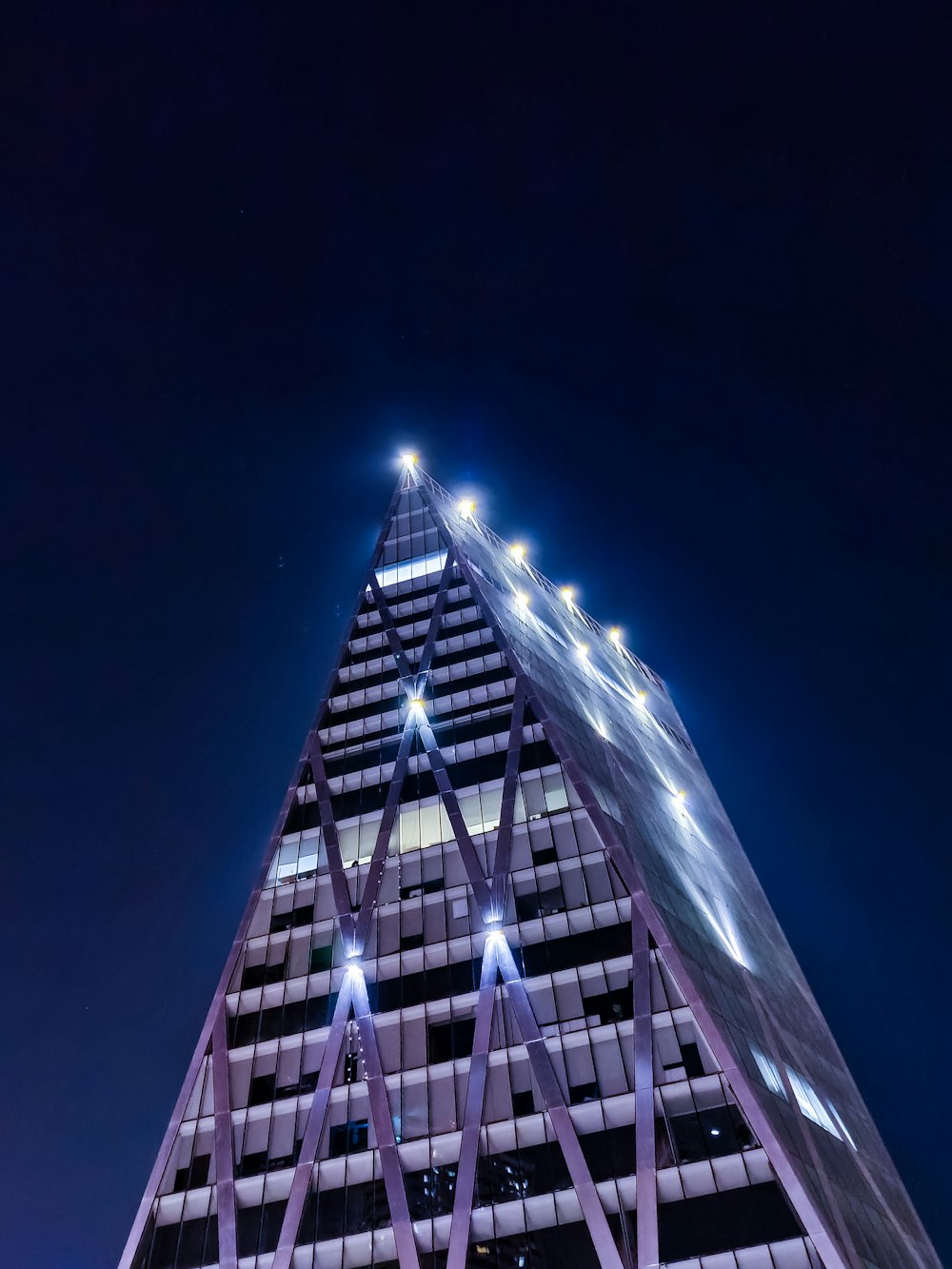 a very tall building lit up at night