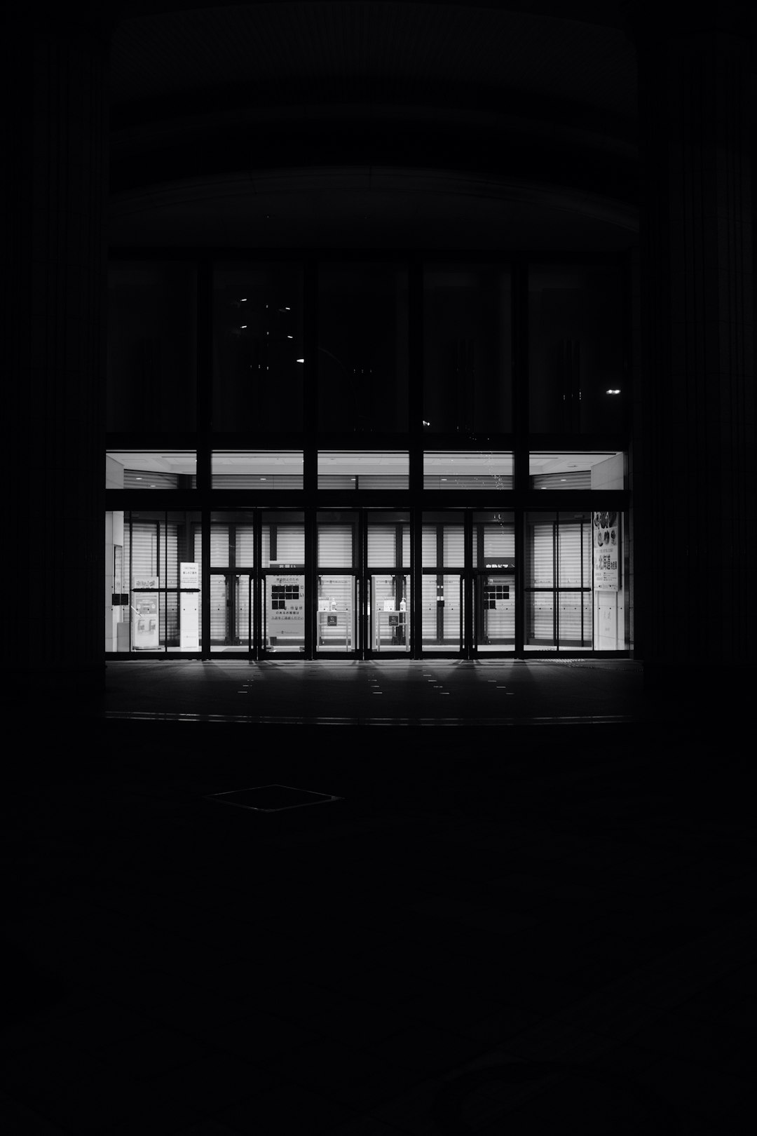 silhouette of person standing near window