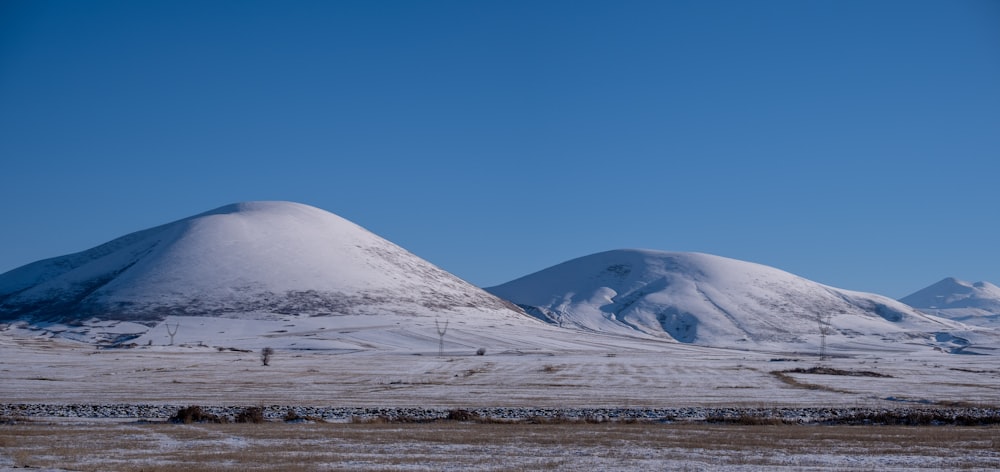 snow covered mountain under blue sky during daytime