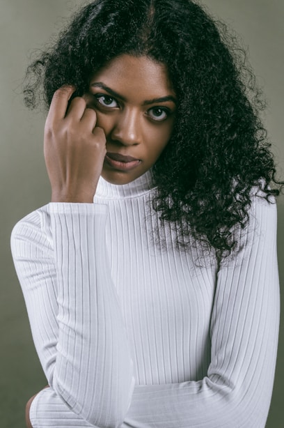 woman in white and gray striped long sleeve shirt