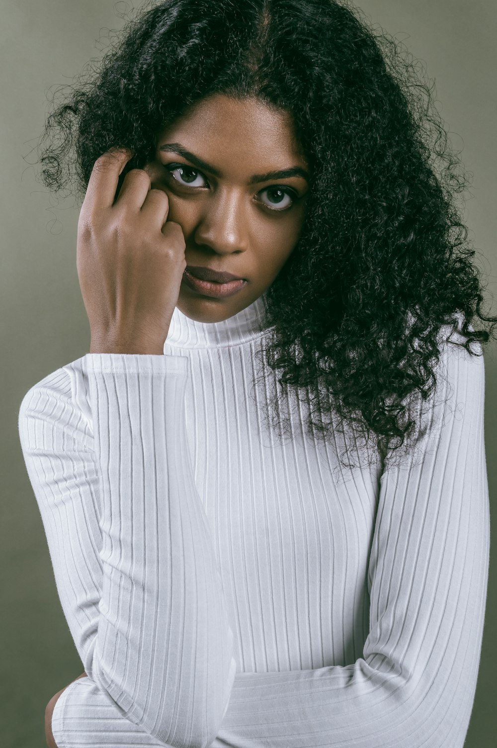 woman in white and gray striped long sleeve shirt