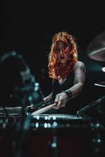 woman in black long sleeve shirt playing piano
