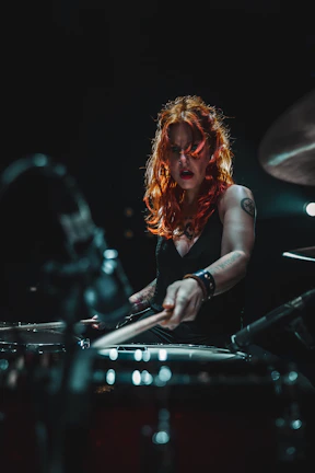 woman in black long sleeve shirt playing piano