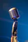 black microphone on blue background