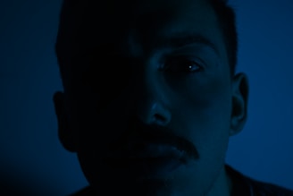 An expressive portrait of a game hero with subtle lighting highlighting facial features and personality.