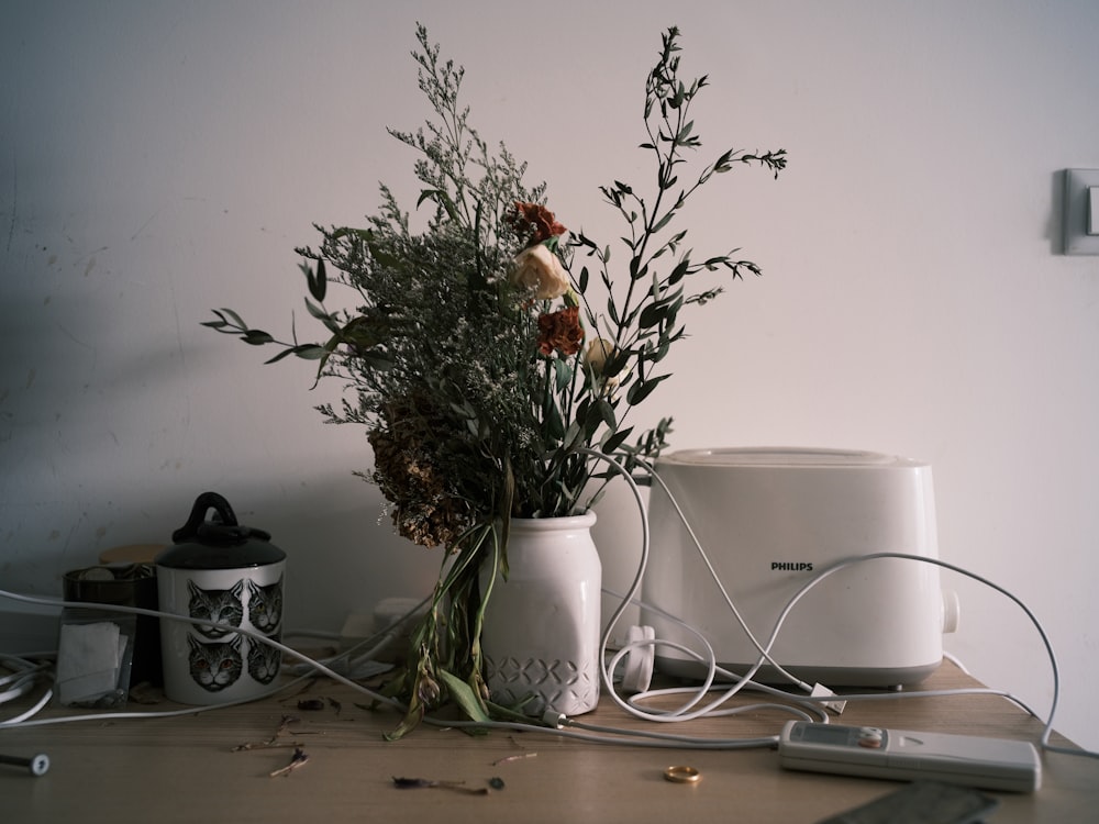 white ceramic mug on white table