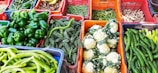Baskets filled with colorful, freshly harvested vegetables from Nigerian fields.
