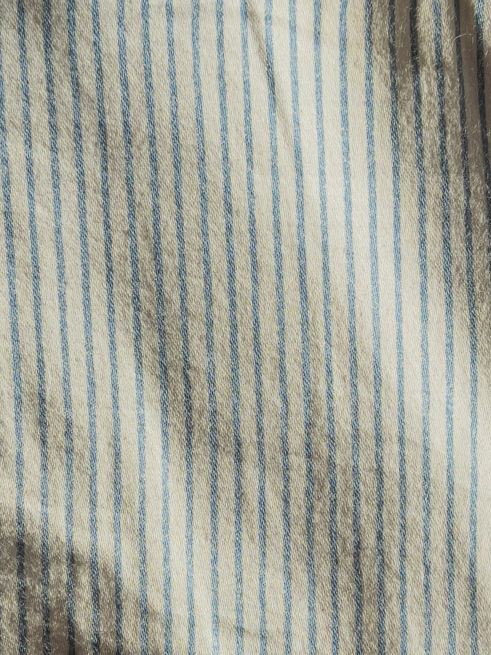 white and blue striped textile