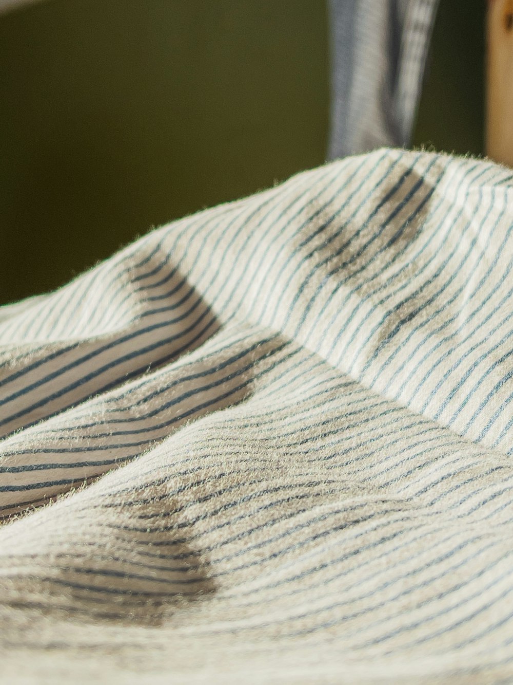 white and blue striped textile