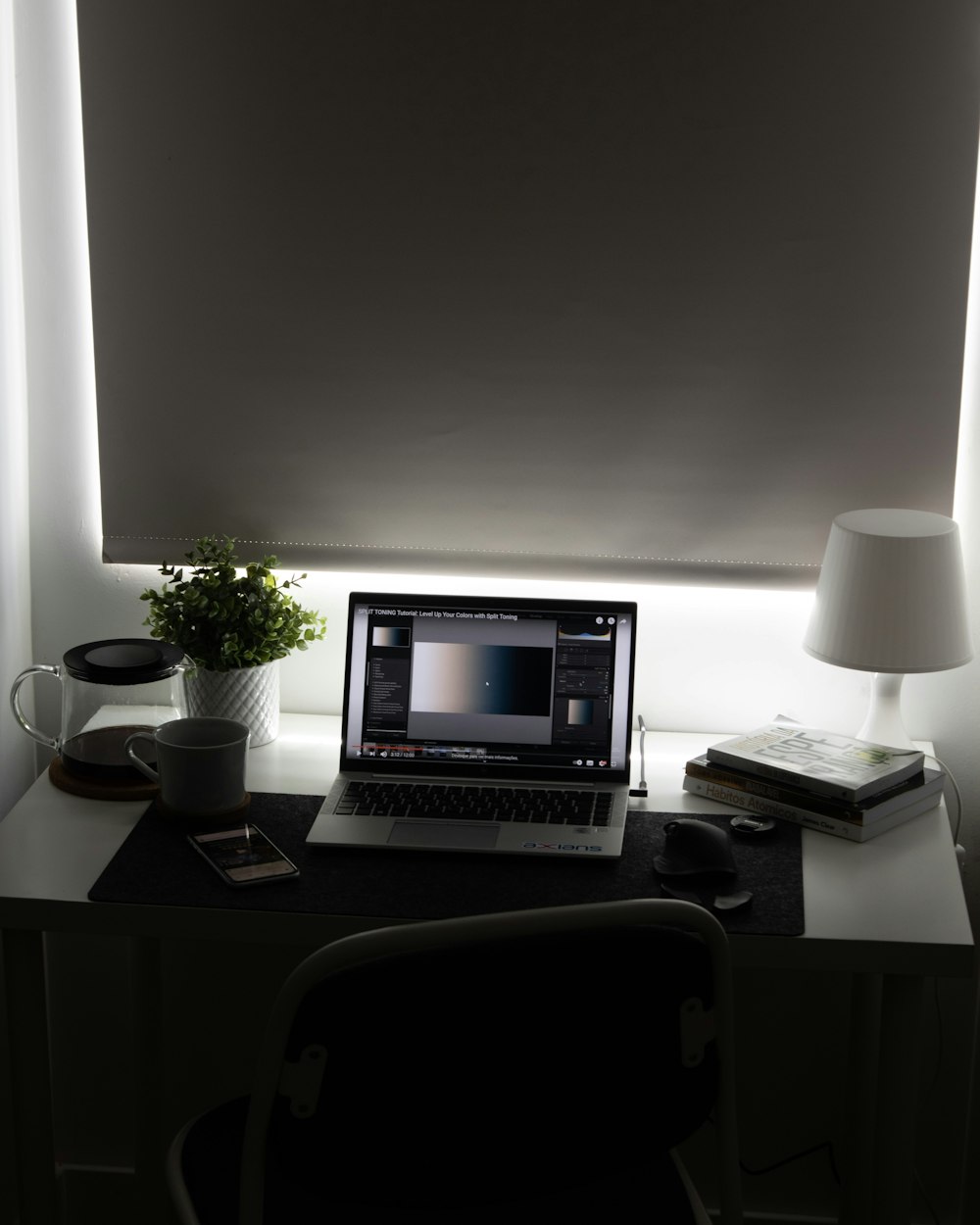 silver macbook pro on brown wooden table