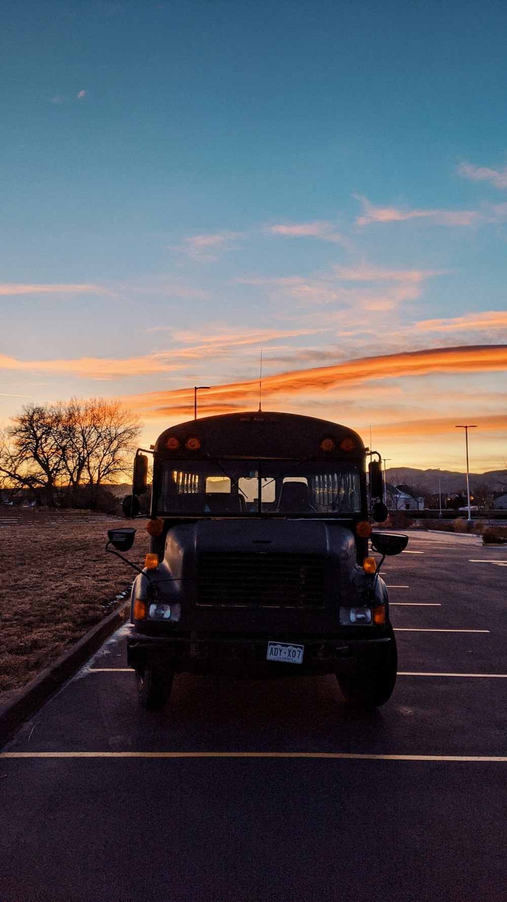 black suv on road during sunset