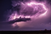 a large cloud with a lightning bolt coming out of it