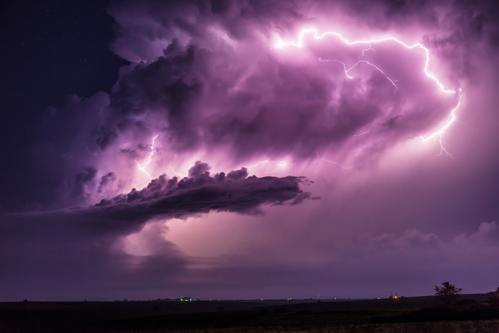 a large cloud with a lightning bolt coming out of it