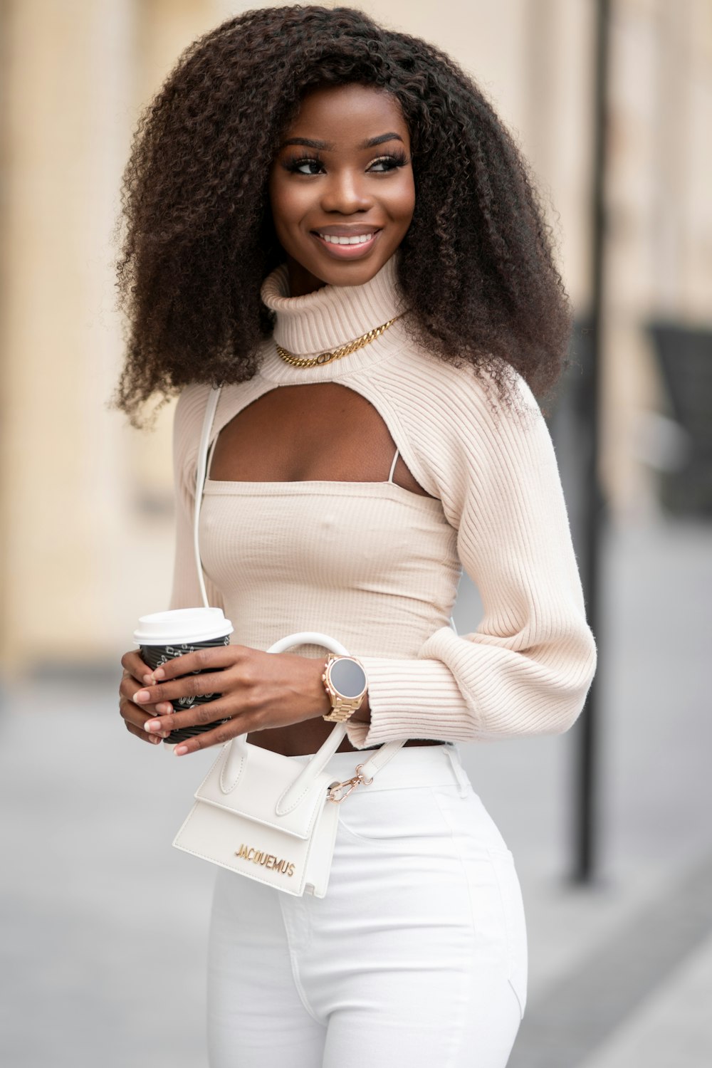 woman in white long sleeve shirt holding white ceramic mug