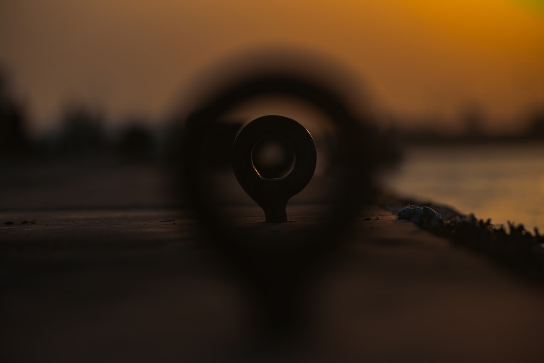 black round metal on brown wooden table