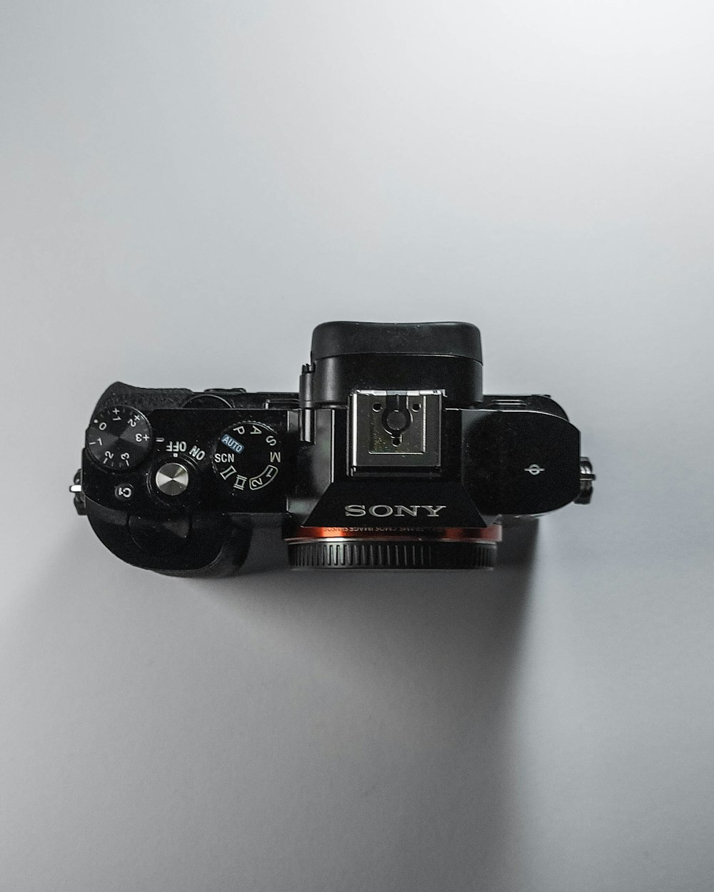 black nikon dslr camera on white surface