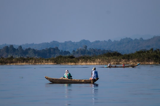 people riding on boat on water during daytime in Kaptai Bangladesh