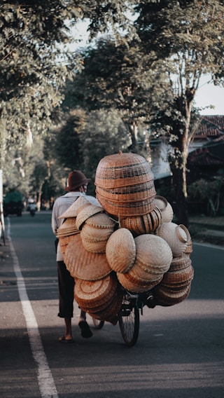 brown wooden round decors on road during daytime