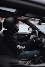 A learner confidently taking a mock driving test in a manual car