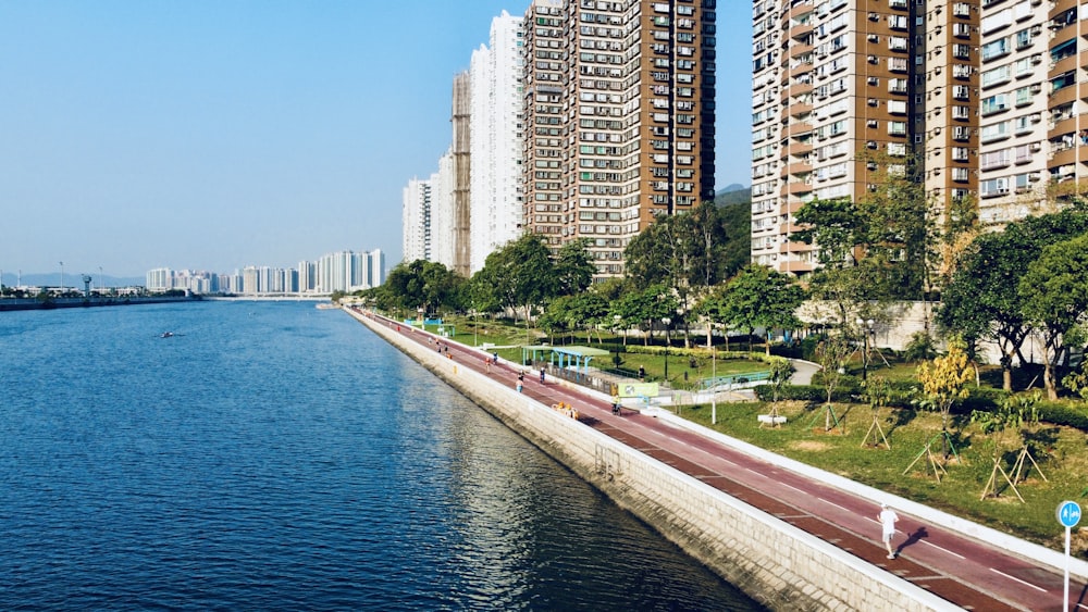 body of water near high rise buildings during daytime