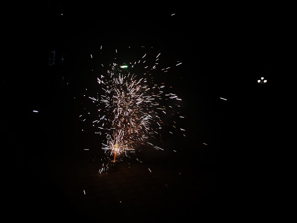 green and white fireworks during nighttime