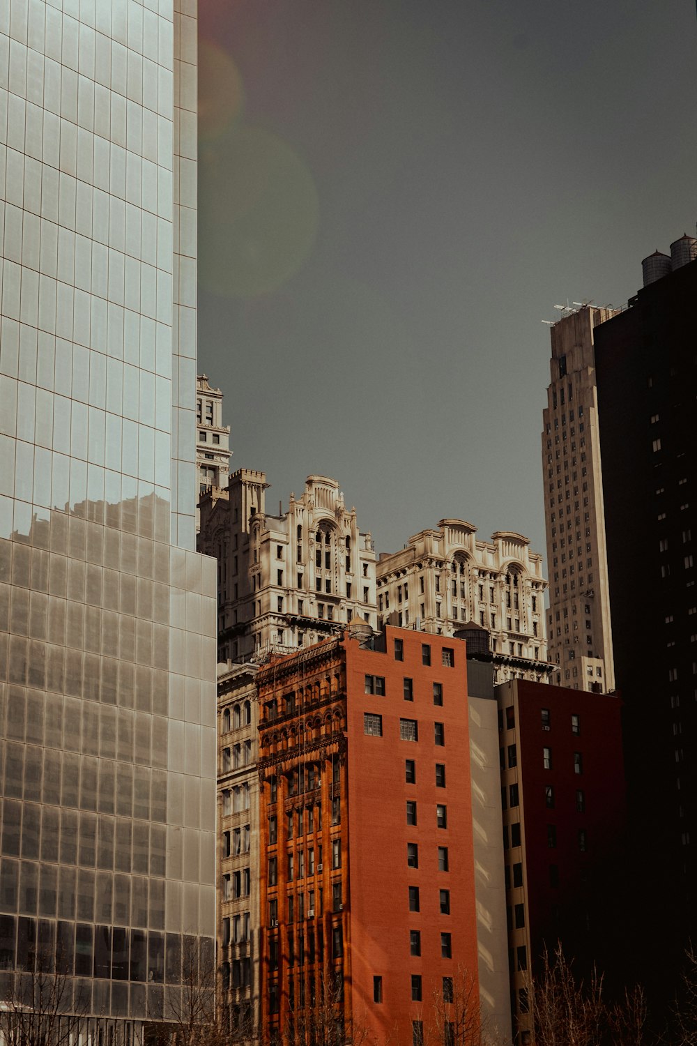 white and brown high rise buildings under blue sky