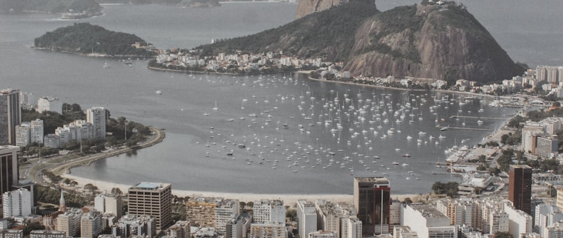 city buildings near body of water during daytime