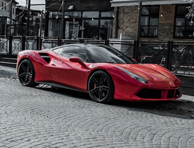 red ferrari 458 italia parked on street