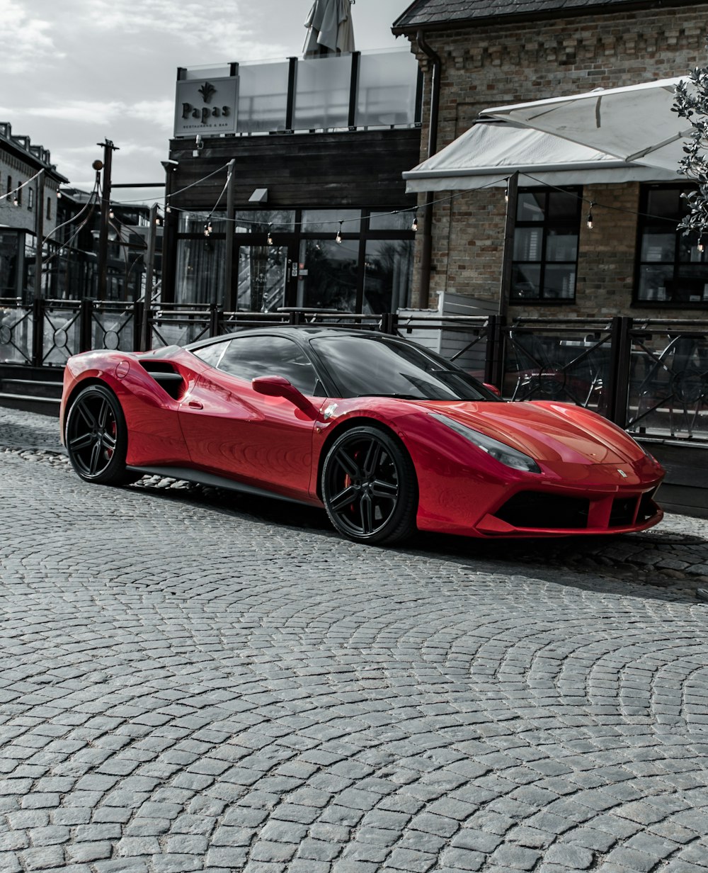 red ferrari 458 italia parked on street