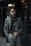 A stylish man confidently wearing modern fashion apparel.