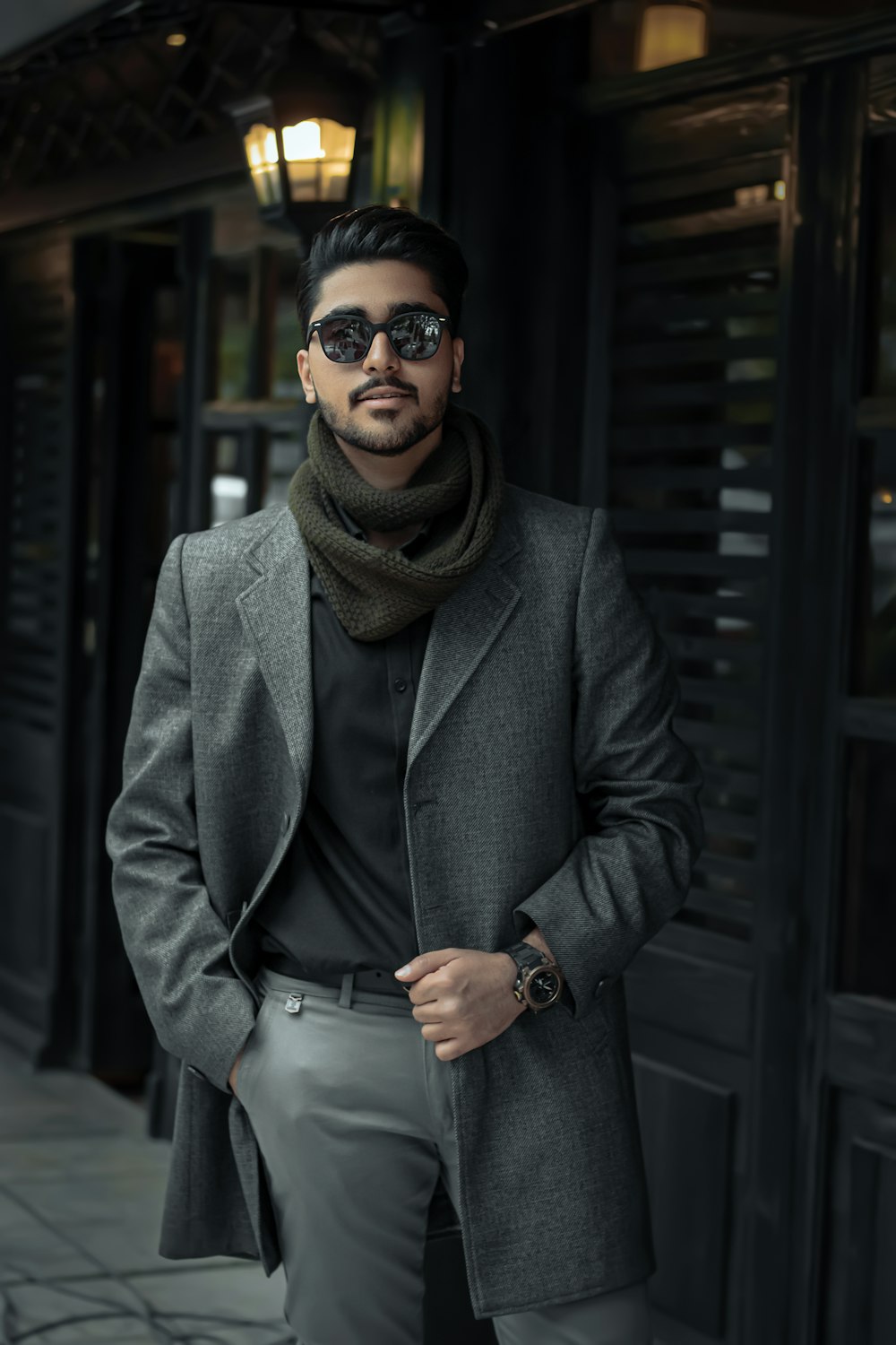 woman in gray coat wearing black sunglasses