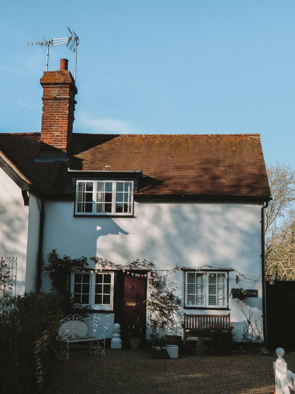 white and brown concrete house under blue sky during daytime