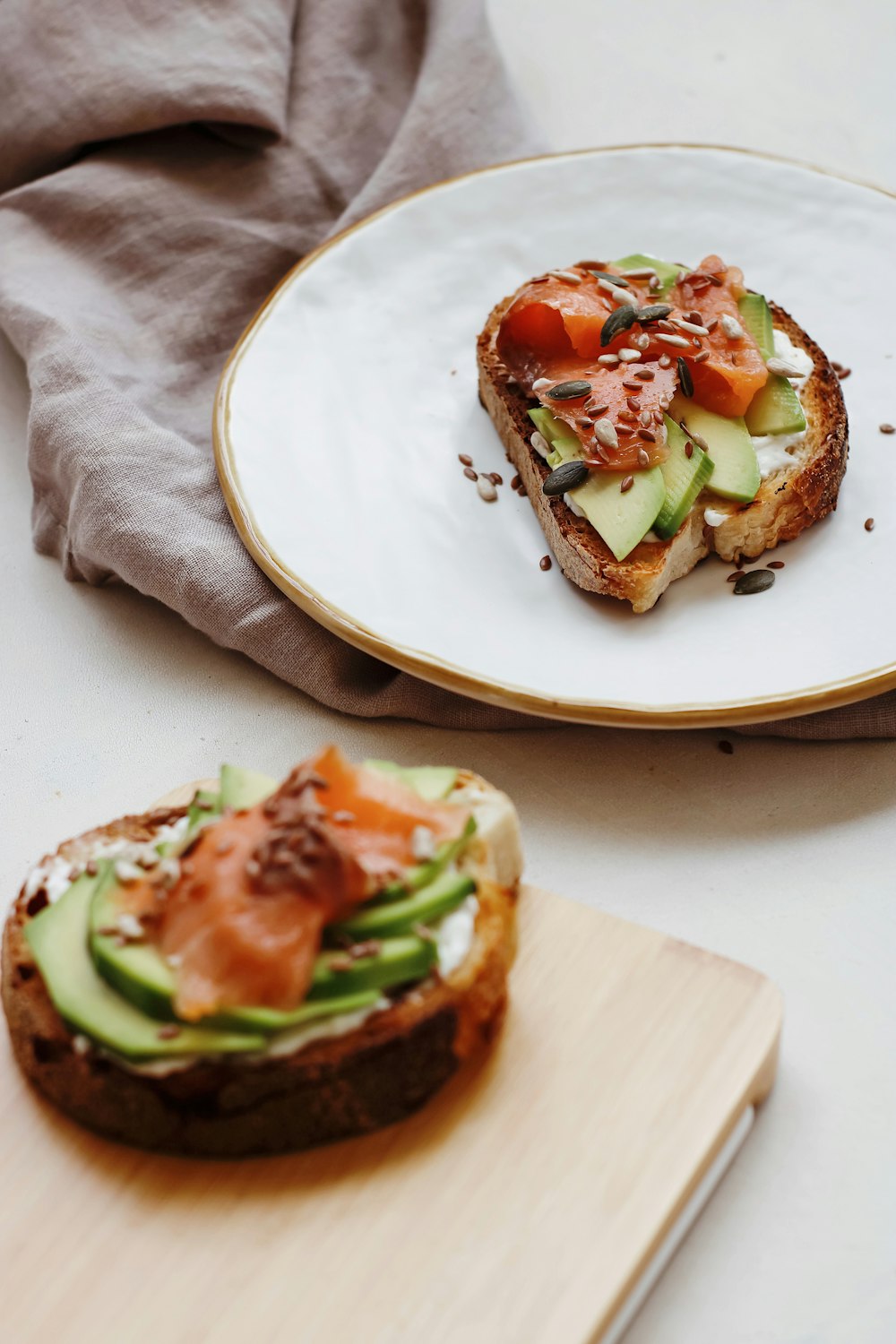 sliced tomato and green vegetable on white ceramic plate